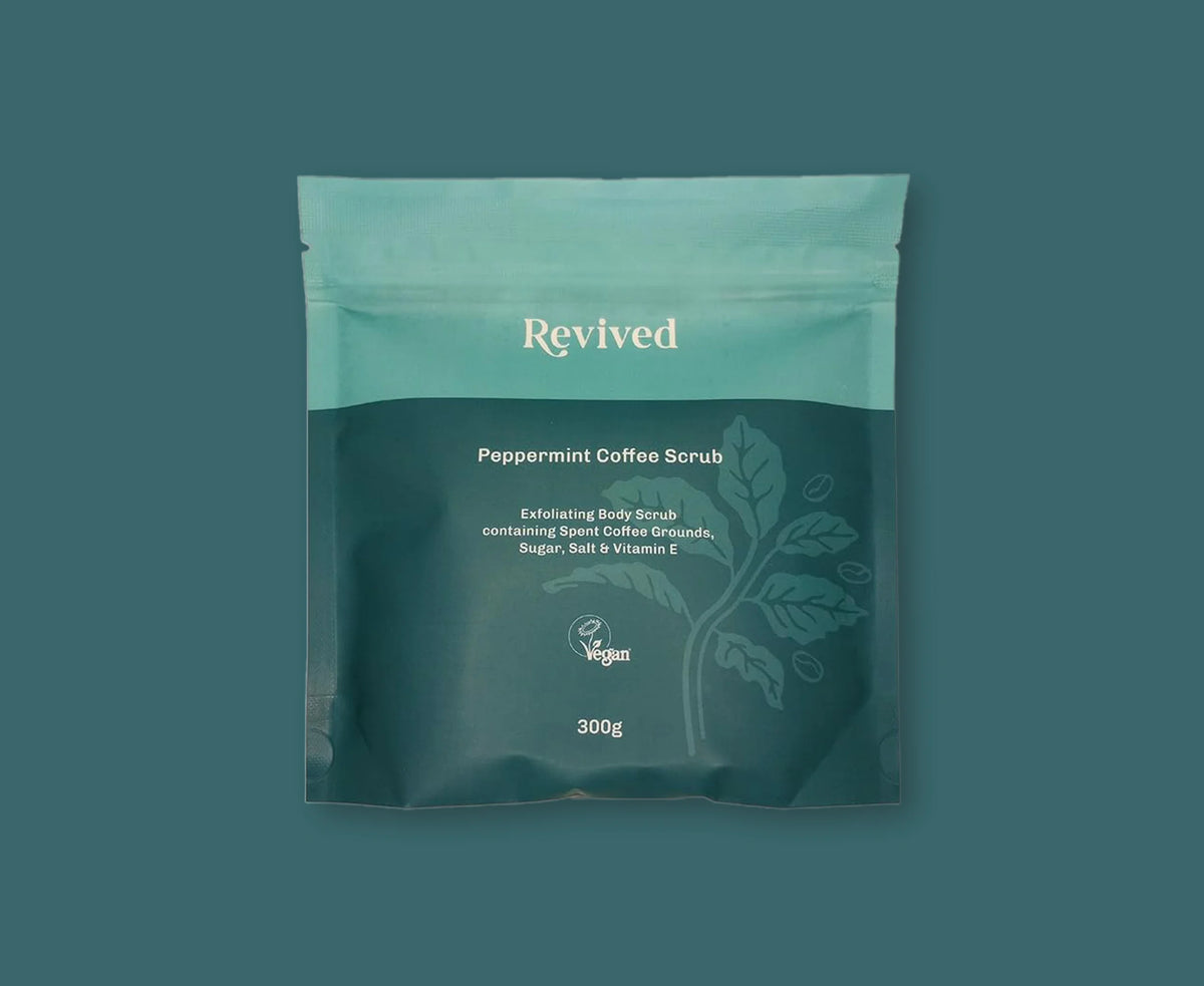 Peppermint coffee scrub package with 'Revived' branding on a teal background